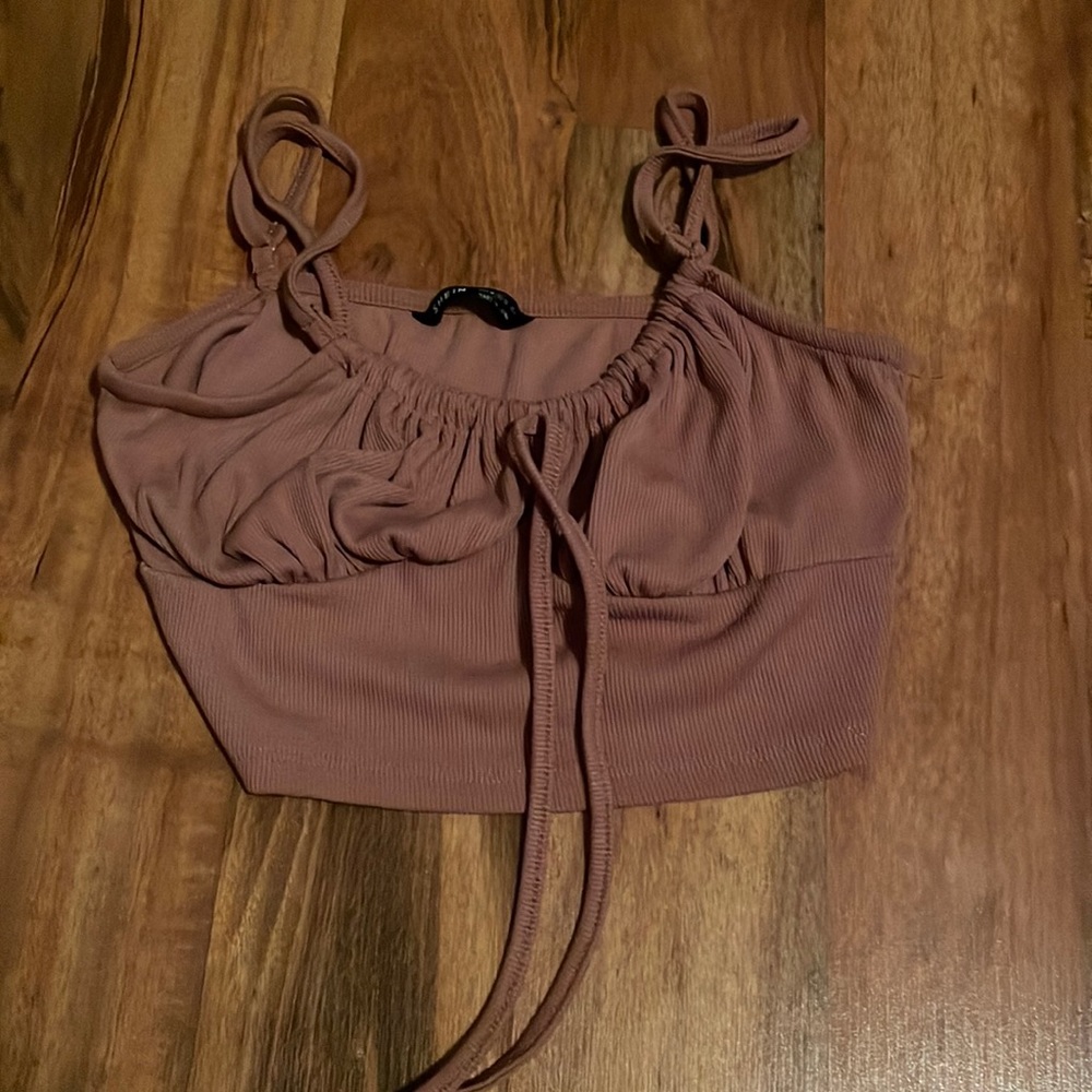 A pink crop top, girls M, from shein.